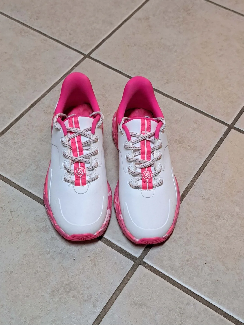 G/FORE Women's MG4+ golf shoes in the Snow/Knockout Pink Colorway